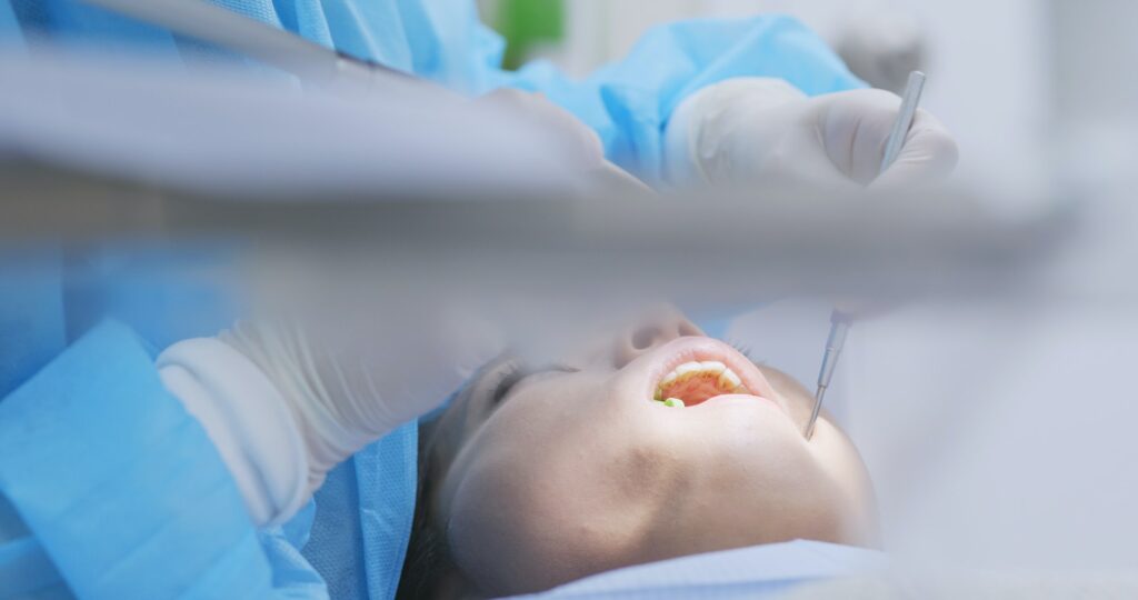Woman undergo professional tooth whitening and ultrasound cleaning at dental clinic